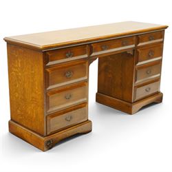 Royal Oak Furniture Company Of Grassington - Georgian design oak kneehole desk, rectangular top with moulded edge, fitted with central frieze drawer flanked by eight graduating drawers, raised on skirted base