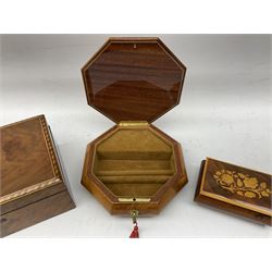 Three walnut boxes, all with floral inlaid decoration, comprising rectangular form example with inlaid panel decorated with blossoming roses and marquetry banding, and two musical jewellery boxes, largest L25cm