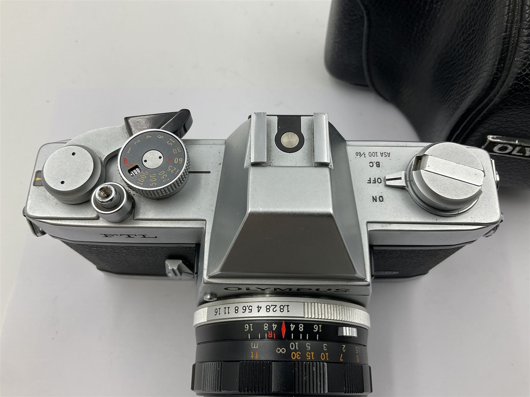 Olympus FTL camera body, serial no. 109019, with 'Olympus F.Zuiko Auto-S 1:1.8 f=50mm' lens serial no. 101434, in leather case 