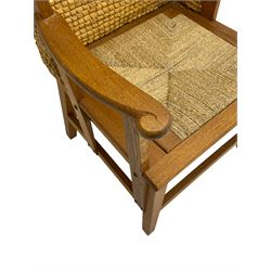 Reynold Eunson (1932–1978) for David Munro Kirkness, Kirkwall, Orkney - oak framed Orkney chair, woven straw canopy back, drop-in rush seat, the arm terminals carved with scrolls, on square tapering supports joined by plain stretchers, the front rail inscribed with makers marks