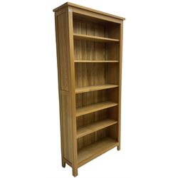 Contemporary light oak open bookcase, fitted with five adjustable shelves