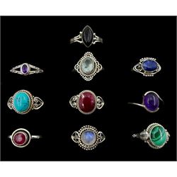 Ten silver stone set rings including turquoise, black onyx, malachite, moonstone, amethyst and blue topaz