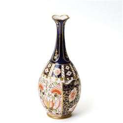 Mixed Royal Crown Derby Imari 6299 pattern wares, including a pair of vases, H8cm; covered twin handled urn, H14cm; slender vase, H19cm, and a pattern 2451 plate, D23cm (5)
