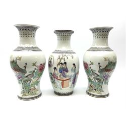 A pair of modern Chinese vases, of baluster form decorated with peacocks upon a white ground, H36.5cm, together with another similar example decorated with figures. 