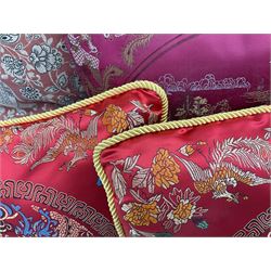 Collection of predominantly Chinese style cushions, to include feather down examples