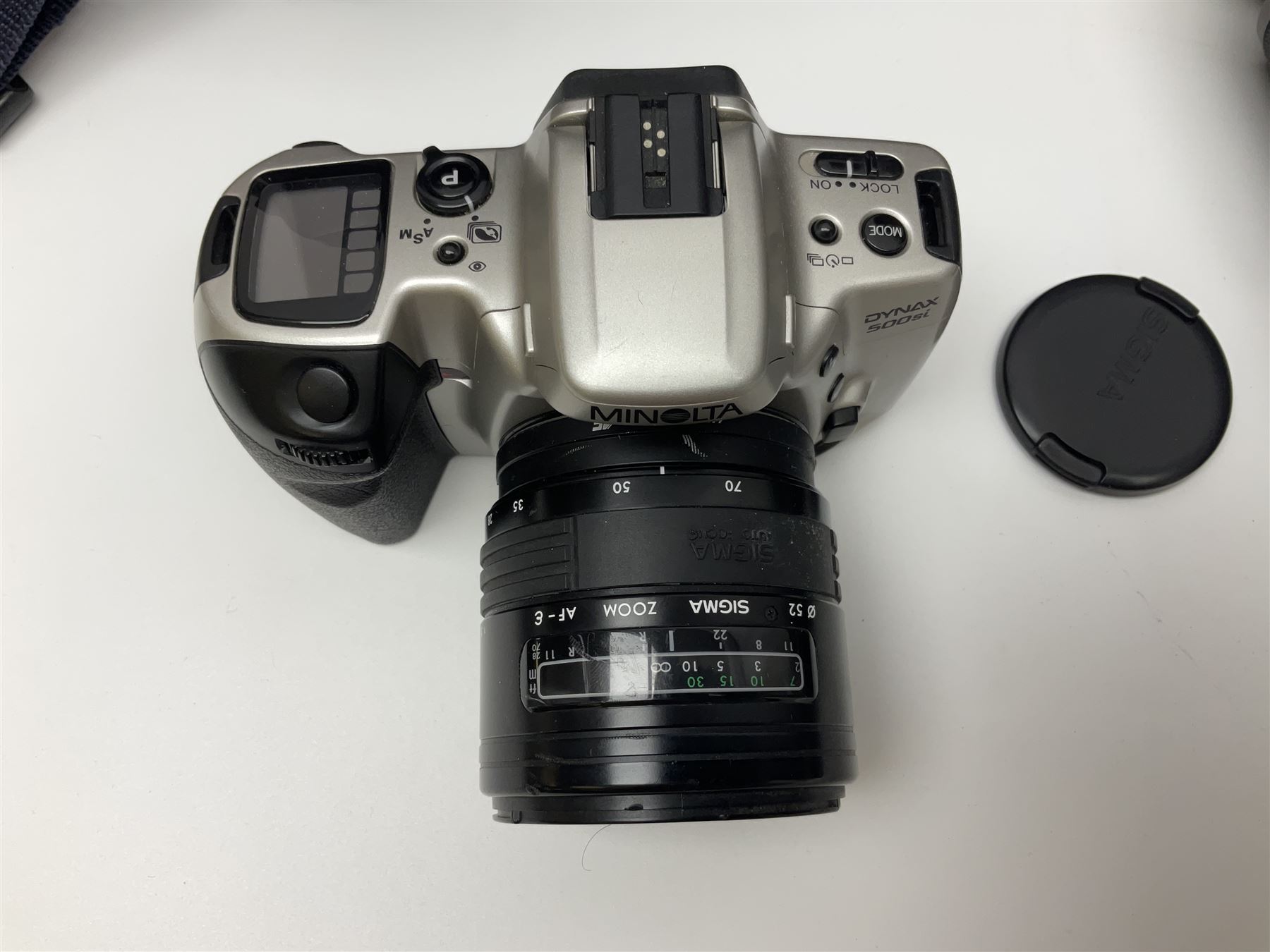 Four Minolta camera bodies, to include Dynax 500si, serial no. 94812651 with 'Signa Zoom 1;3.5-4.5 f=28-70mm' lens, Maxxum 300si, serial no. 97821665, with 'Tamron AF 80-210mm' lens and Dynax 300si, serial no 01603265'  with Minolta AF Power Zoom 35-80mm 1;4' lens, etc, together with Pantax MV1 camera bodies and other camera equipment 