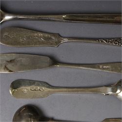 George III silver marrow scoop, hallmarked London 1767, makers mark indistinct, together with a collection of silver condiment spoons and butter knives, all hallmarked