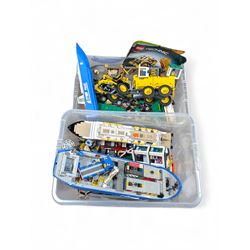 Two boxes of partially built Lego vehicles, including Lego Technics Dumper Truck no. 8264, Titanic, container ships, police boat, smaller police vehicles, etc
