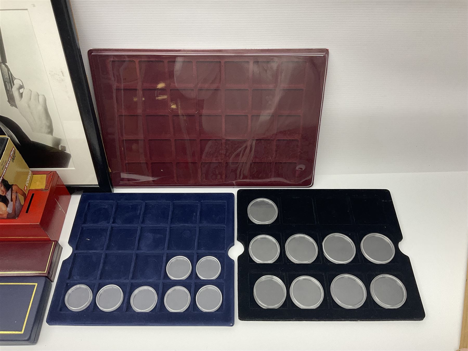 Pierce Brosnan framed picture, James Bond books, Corgi Tomorrow Never Dies BMW 750i model, small number of stamps, empty coin displays and other miscellaneous items