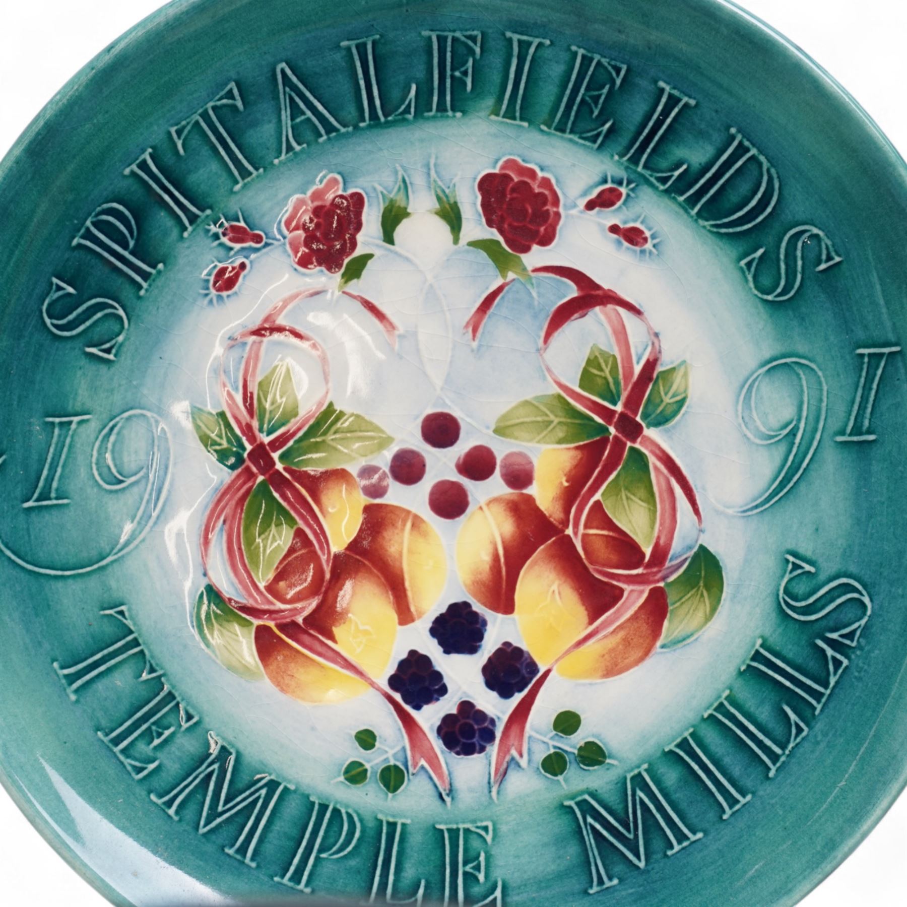 Moorcroft limited edition Birth of Light pattern millennium year plate, numbered 699/2000, impressed and painted marks to base; together with three other year plates comprising 1998, 1992 and Spitalfields Temple Mills edition 1991 plate (4)