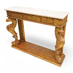 Pair of carved giltwood and composition console or pier tables, rectangular variegated rouge marble top, the frieze decorated with trailing vine and grape bunches, eagle front supports on stepped rectangular base