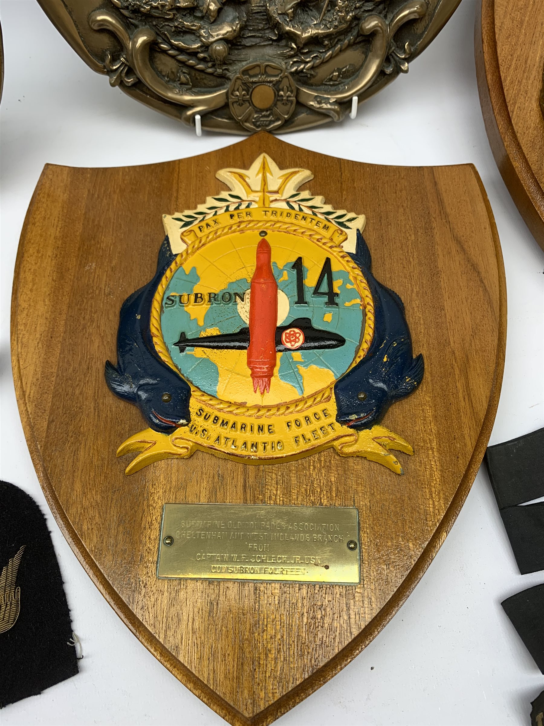  Two Submarine Force US Atlantic Fleet presentation plaques, the first detailed Subron 14, the second USS Abraham Lincoln 602, each H32.5cm, together with five uniform patches, four cap tallies, detailed HSM Tamar (x3), and HMS Ganges, and a set of two limited edition Euro Tunnel commemorative presentation plaques, The Breakthrough 1st December 1990 and Celebration 6th May 1994, D27cm, complete with original certificates.  