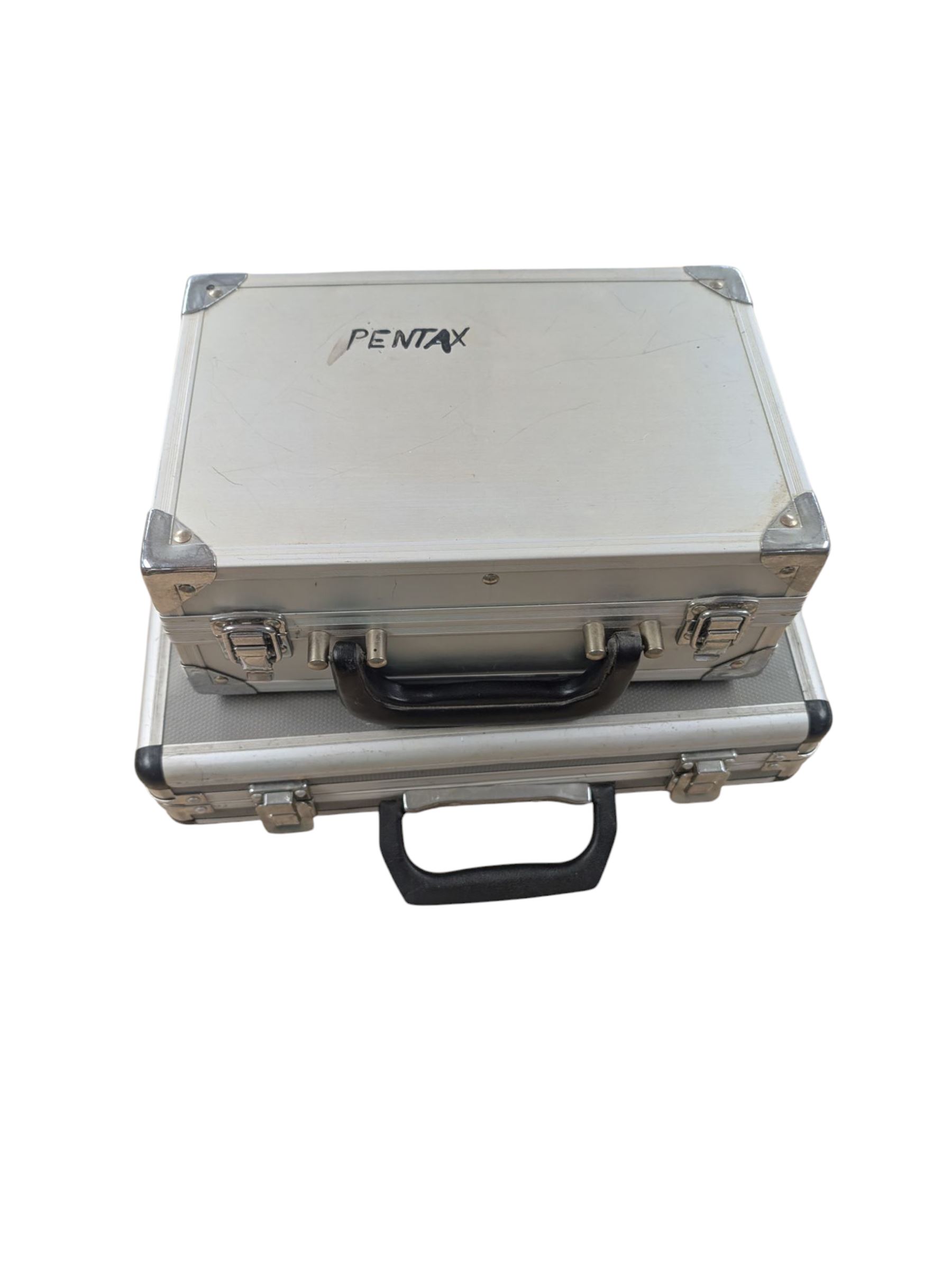 Two Pentax Auto 110 camera bodies and accessories including flashes, winder and lenses, all within two flight cases