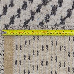 Contemporary Beni Ourain style wool rug, woven with a cream field and dark brown geometric chevron lattice, centred by repeating small diamond medallions, with short fringe ends