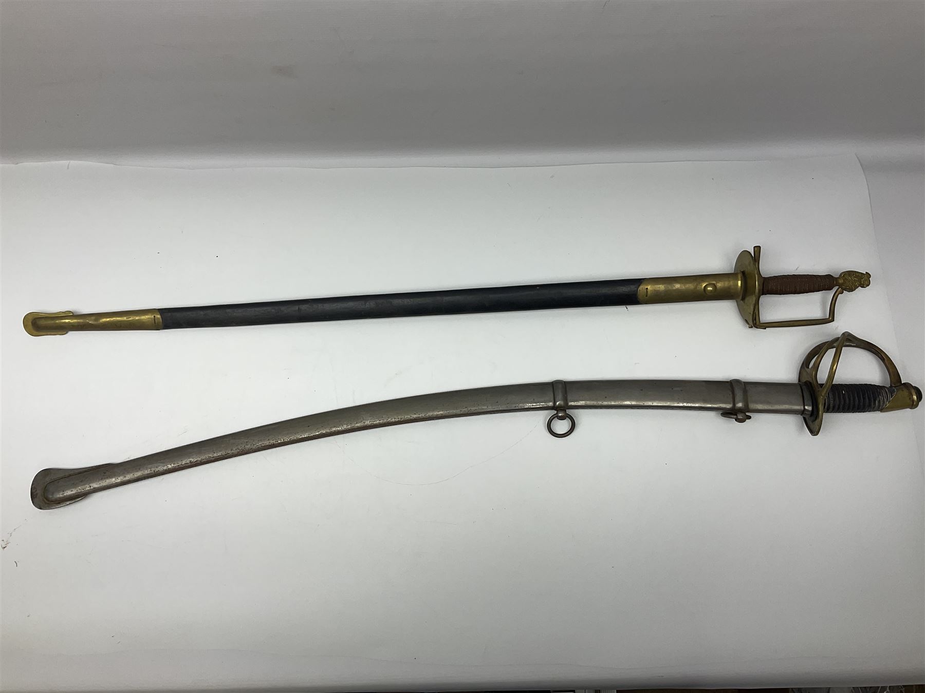 Reproduction American Civil War Cavalry trooper's sword, the 88cm slightly curving fullered steel blade marked to the ricasso 'Ames & Co Chicopee Mass.' and 'US ADK 1862'; brass hilt and leather covered grip; in steel scabbard; and Indian reproduction 19th century French court sword (2)