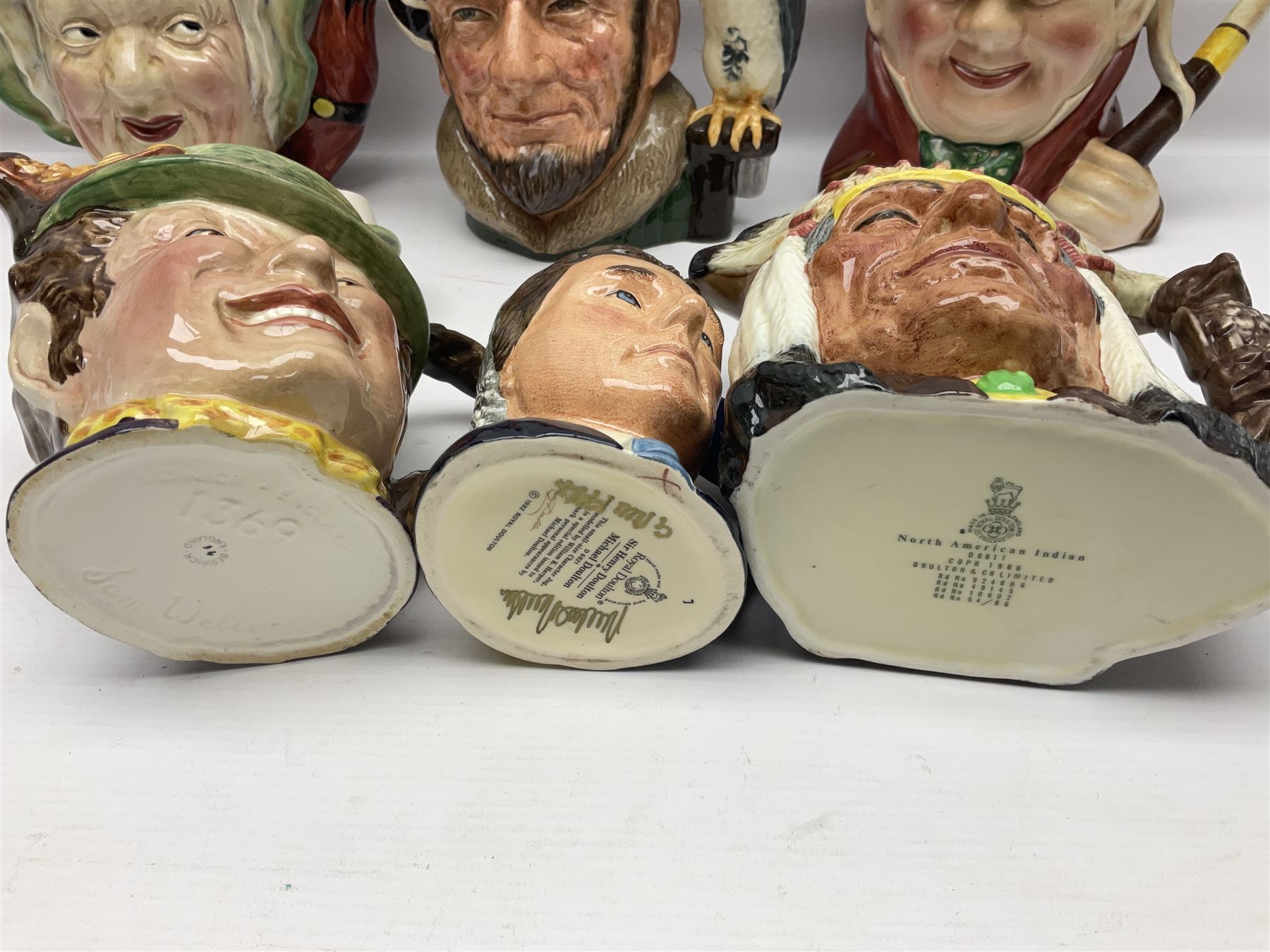 Collection of Royal Doulton and Beswick character jugs of various sizes, including North American Indian D6611, The Falconer D6533,  Tony Weller 281, Sairey Gamp 371 etc