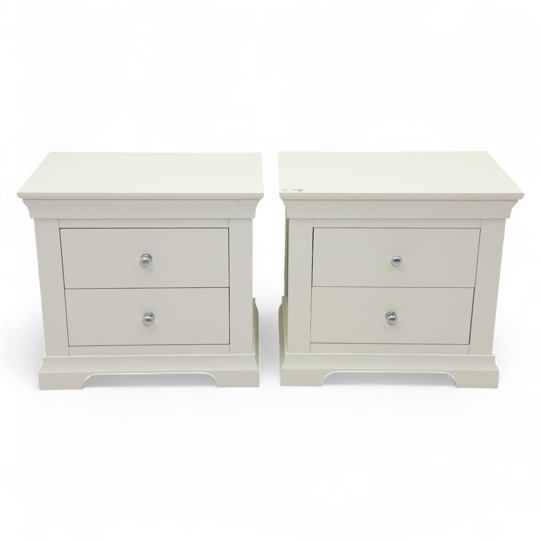 Coxwold Company - pair of white painted jumbo bedside cabinets, with two deep drawers and chrome knob handles,  shaped apron base
