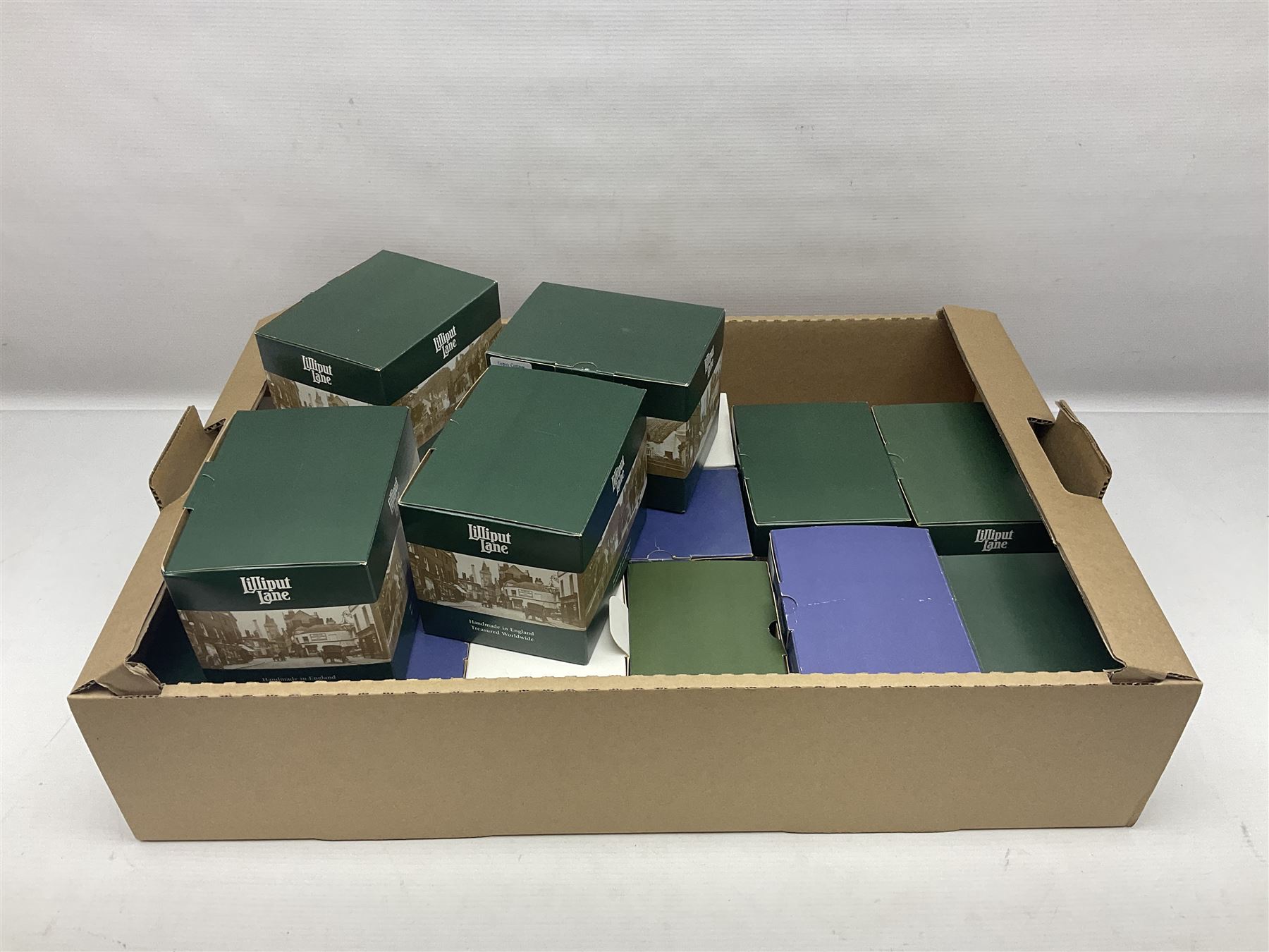 Eighteen Lilliput Lanes, including The Penny Farthing, The Pigsty, Borrowdale School, Fairy Cake Tearoom, An Apple a Day,Ladybird Cottage etc, all with original boxes 