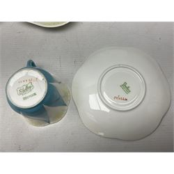 Shelley Dainty pattern tea wares, of lobed form with blue star decoration on merging white and yellow ground, comprising five teacups, five saucers, six tea plates, milk jug and cake plate, all with printed green mark beneath, some with painted pattern no 11770