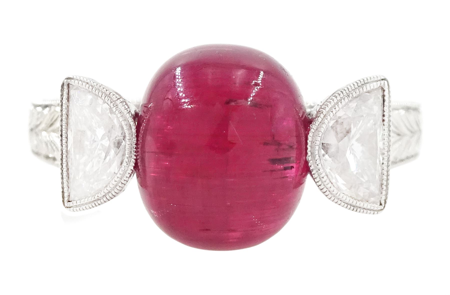 18ct white gold pink tourmaline and diamond ring, single oval cabochon cut tourmaline of approx 4.75 carat, set with a half moon cut diamond either side, to engraved laurel leaf design shoulders