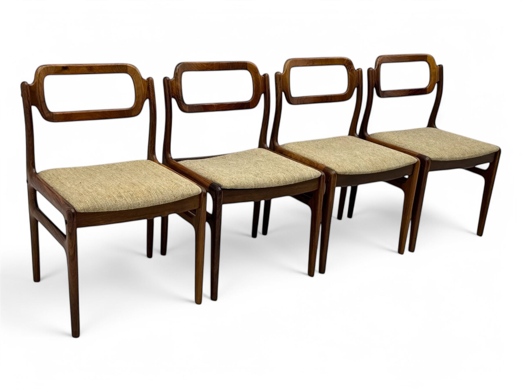 Johannes Andersen for Uldum Mobelfabrik - set of eight Danish teak dining chairs, each with open back rests with curved edges, upholstered seats in a neutral woven fabric, raised on tapered supports