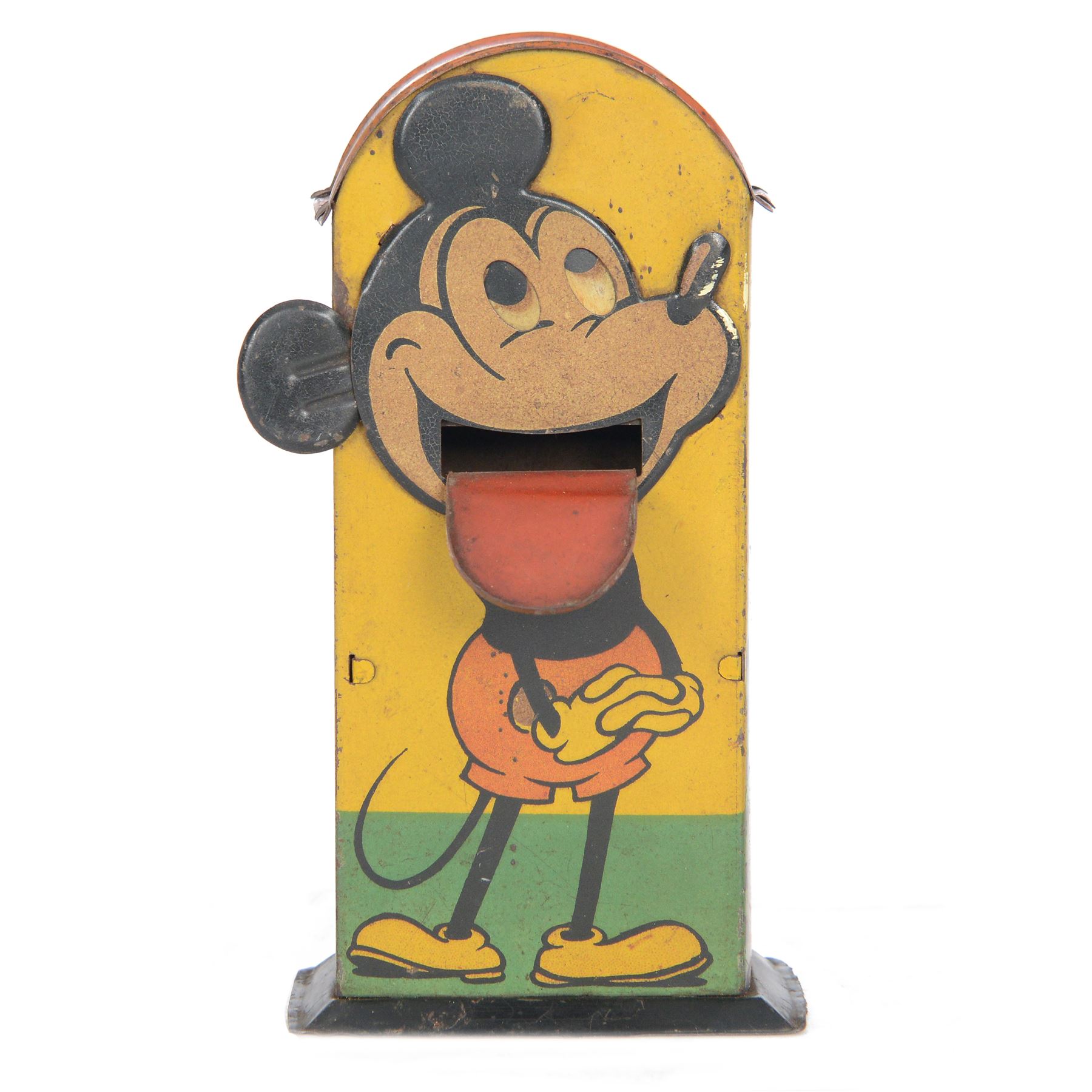 1930s Saalheimer & Strauss Mickey Mouse 'Smile Please' mechanical tin plate money box, depicting Mickey Mouse posing with folded hands to the front and verso as a photographer, above the motto 'If you only pull my ear you will see my tongue appear. Place a coin upon my tongue save your money while you're young', marked to one side 'By exclusive arrangement with Ideal Films Ltd. All rights reserved. Registered No 508041', with key, H17cm

