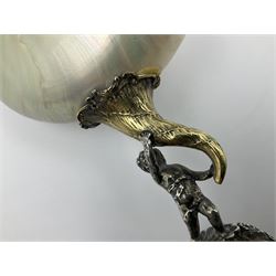 Modern limited edition silver mounted nautilus shell cup, no. 42/150, the pearlescent shell cup with silver-gilt strapwork to rim, upon a stem modelled as a putto supporting a gilt cornucopia and circular domed foot depicting Poseidon amongst swirling waves, hallmarked by St James House Company, London 1980,  H17.5cm