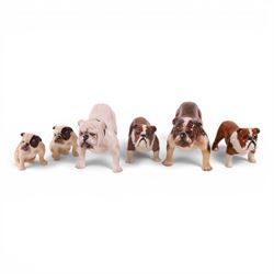 Two Royal Doulton Brindle bulldogs,1047, together with a pair of Beswick Bosun bulldogs an...
