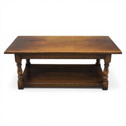 Oak coffee rectangular table, in the manner of Titchmarsh & Goodwin, raised on turned supports united by a full length undertier