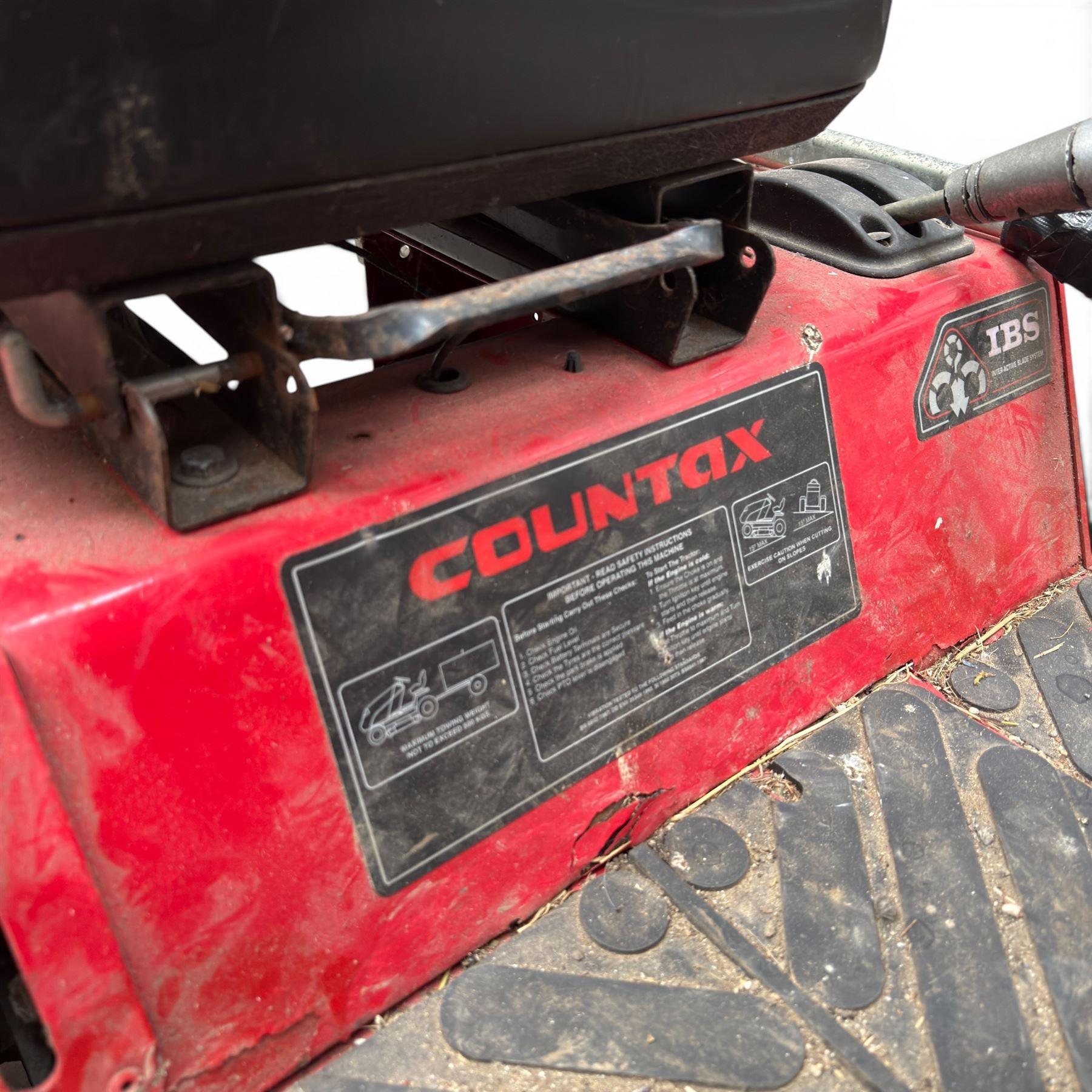 Countax C600H - ride on lawnmower / yard tractor with Honda engine, black seat and red bodywork.