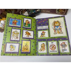 Two boxed Bradgate Penny Puppywalker dolls; Garfield soft toy and Panini sticker album; boxed Stylophone with instructional 45rpm record; and other toys
