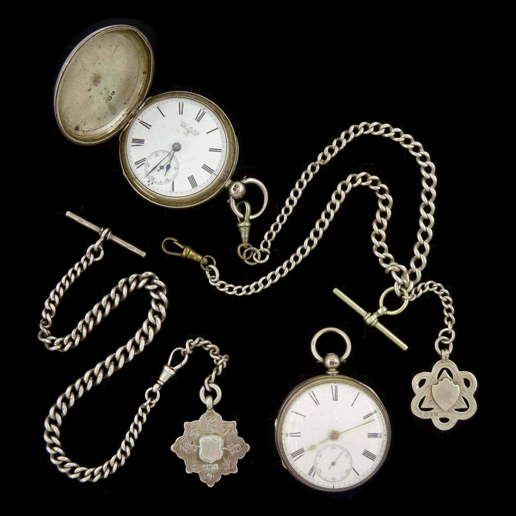 Victorian silver full hunter key wound fusee lever pocket watch by Cole & Son, Sherbourne, No. 783, case by James Oliver, London,1885 and one other silver open face fusee lever pocket watch, both with white enamel dials, Roman numeral hour markers and subsidiary seconds dials and two silver Albert chains with fobs