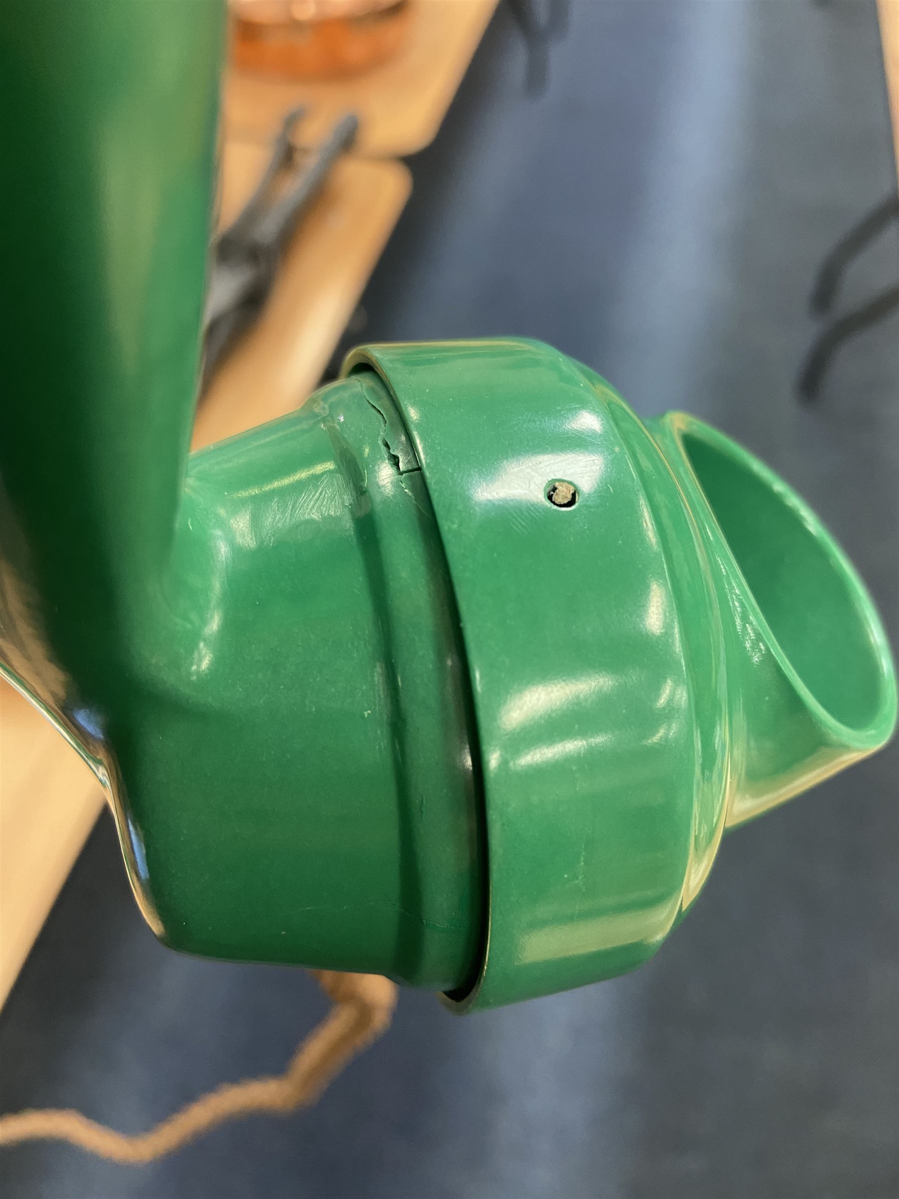 Jade green Bakelite telephone, of pyramid form with alphabet dial, brown braided handset cord and a base draw