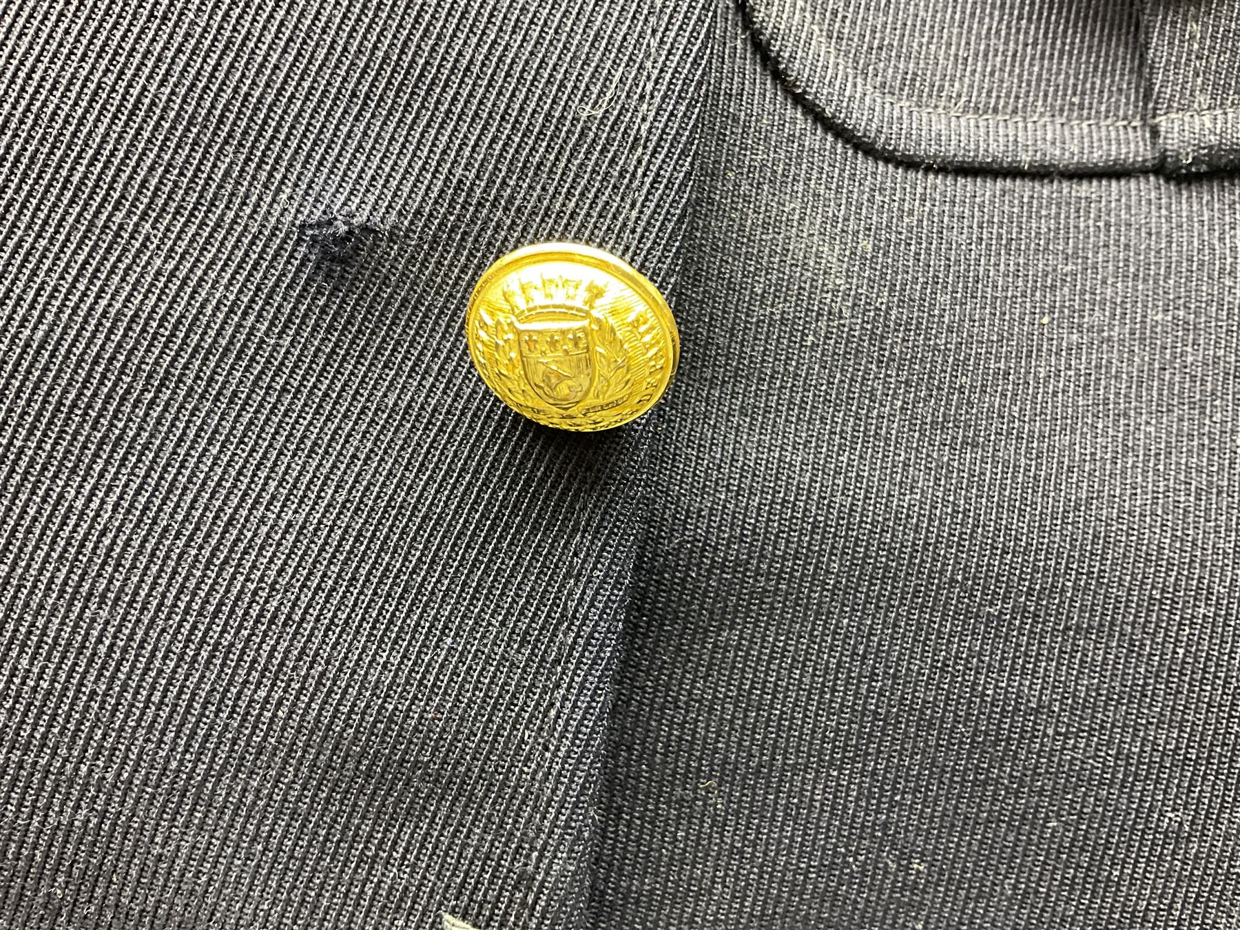 Mid 20th century French Ugeco Nantes first class dress navy blue uniform with ribbon bar with cap, and quantity of Sapeurs Pompiers patches, Sapeurs Pompiers de Caen belt buckle etc