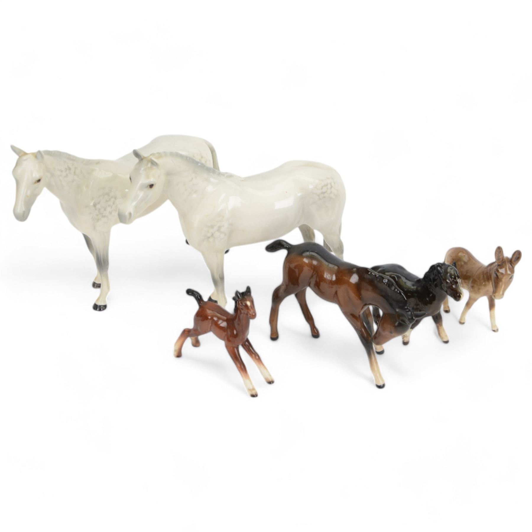Group of Beswick horse and donkey figures, including Connoisseur Model Mill Reef, Shetland Pony no. 1034 and Bois Roussell no. 701