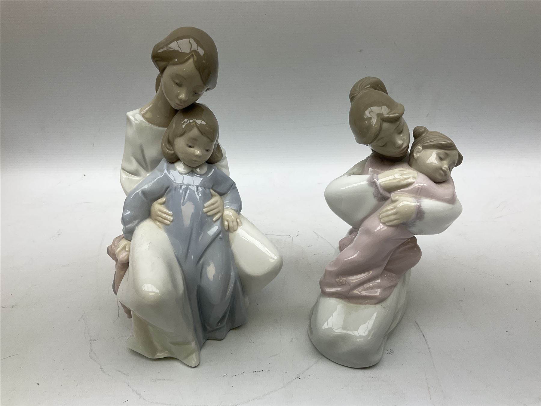 Collection of Nao figures, to include 'Moment with Mummy' no.1429, 'Stories with Grandma' no.1512, 'A Hug of Love' no.1467, together with fourteen further Nao figures and a Cascades clown figure