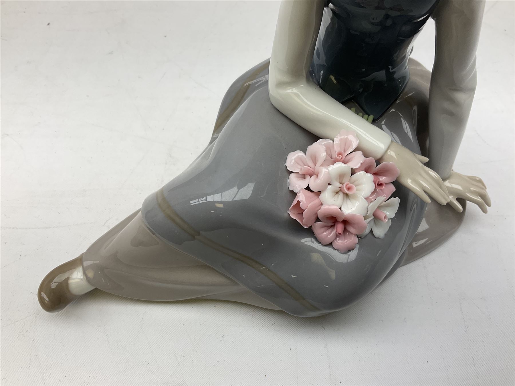 Four Lladro figures, comprising Afternoon Promenade no 7636, Nostalgia no 5071, both with original boxes, Girl with Lilies no 4972 and Madonna no 4534, largest example H27cm