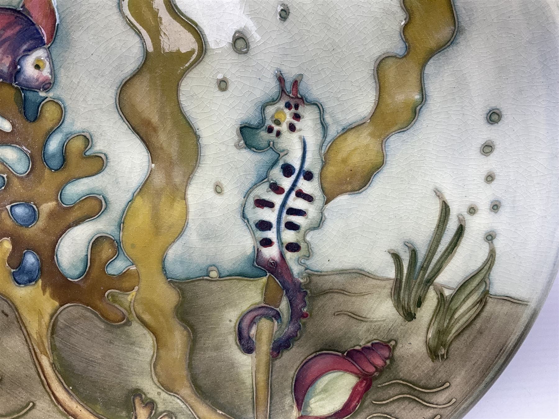 Moorcroft charger decorated in Seahorse pattern, circa 1960, with painted and impressed marks beneath, D26cm