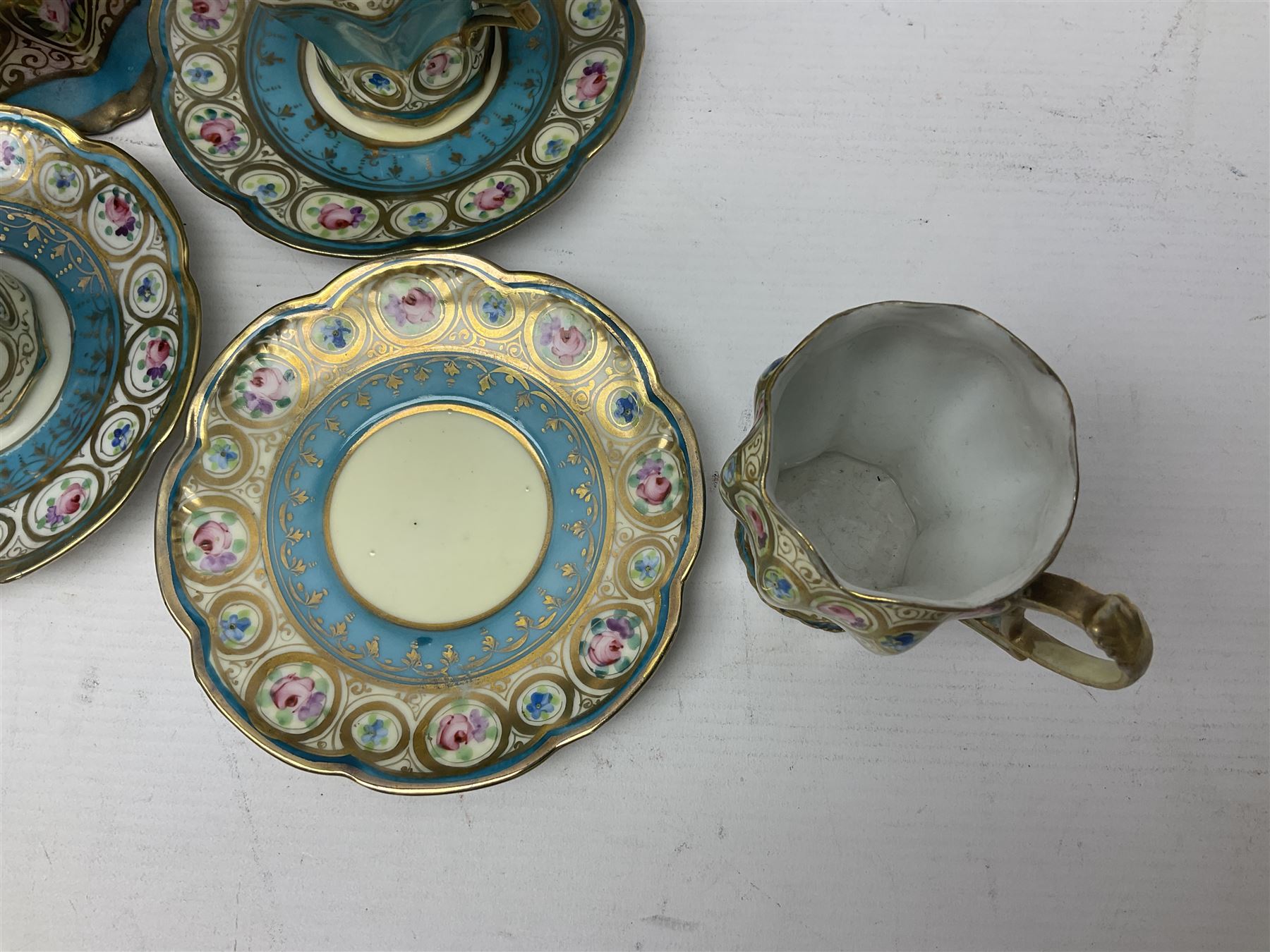 Noritake coffee service, hand painted with roses and gilt detail on a blue ground, comrosing coffee pot, five cups and saucers