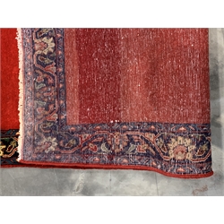 Persian Tabriz runner rug, plain red ground field, trailing stylised foliage and flower head border, 405cm x 79cm