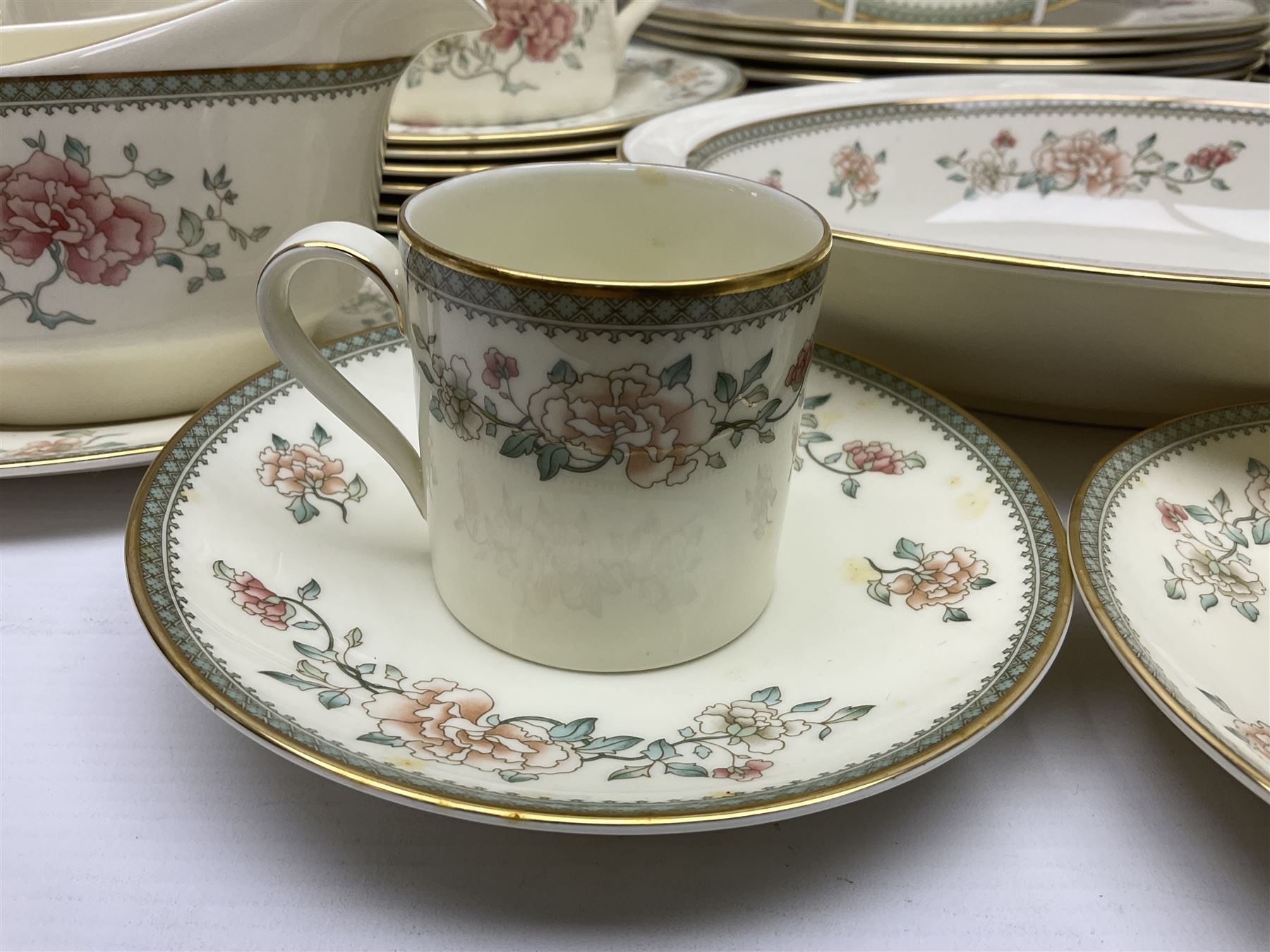 Minton Jasmine pattern tea and dinner wares, including dinner plates, sauce boats, side plates, bowls, teacups, coffee cans and twin handled soup bowls, etc (122)