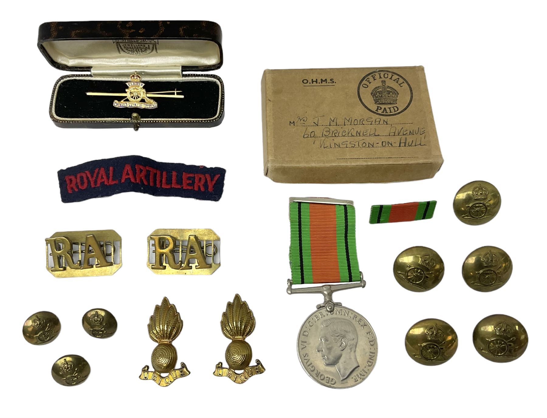 Royal Artillery 9ct gold and enamel sweetheart brooch in original box; together with Royal Artillery shoulder title, brass badges and buttons; and WW2 Defence Medal in issue box to 232775 addressed to Mrs. J.M. Morgan
