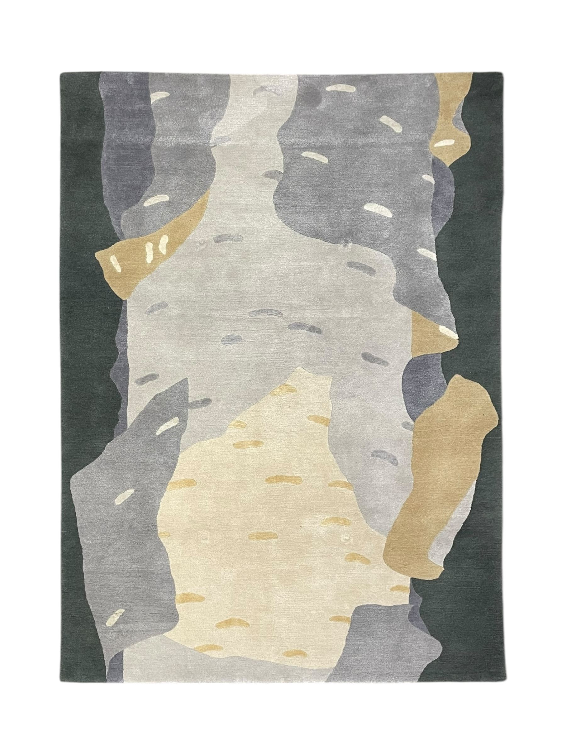 Deirdre Dyson London - 'Birch Tree' abstract rug, shades of grey and green depicting a birch trunk 