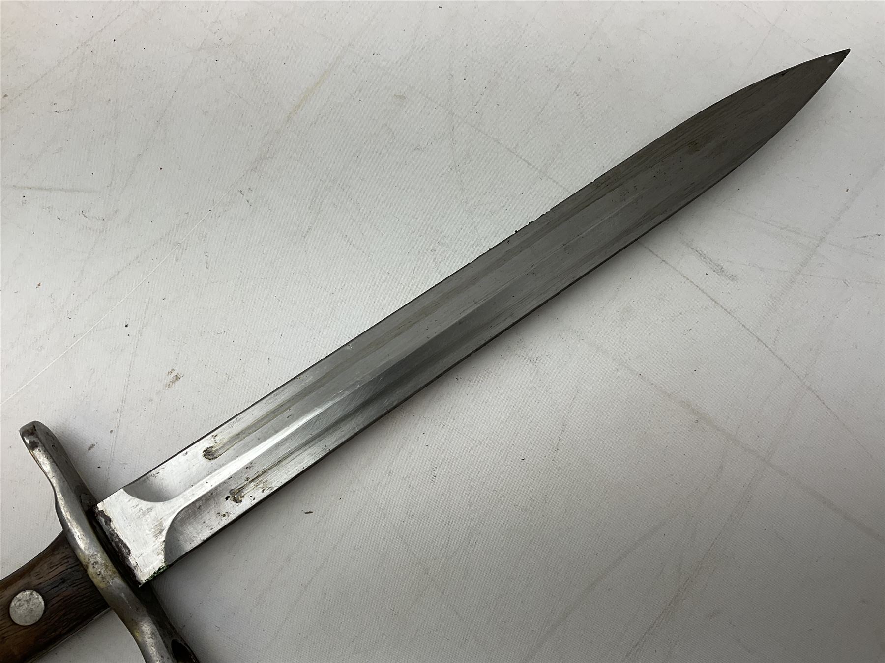Schmidt-Rubin Model 1918 bayonet, the 30cm steel blade marked Elsener Schwyz, cross-piece numbered 813558; in steel scabbard with leather frog stamped E. Banga Sattler Selzac 67 L45.5cm overall; and Swiss Model 1957 SIG rifle bayonet by Wenger; in plastic scabbard with leather frog stamped E. Walty Sattlerei Baretswil 84 (2)