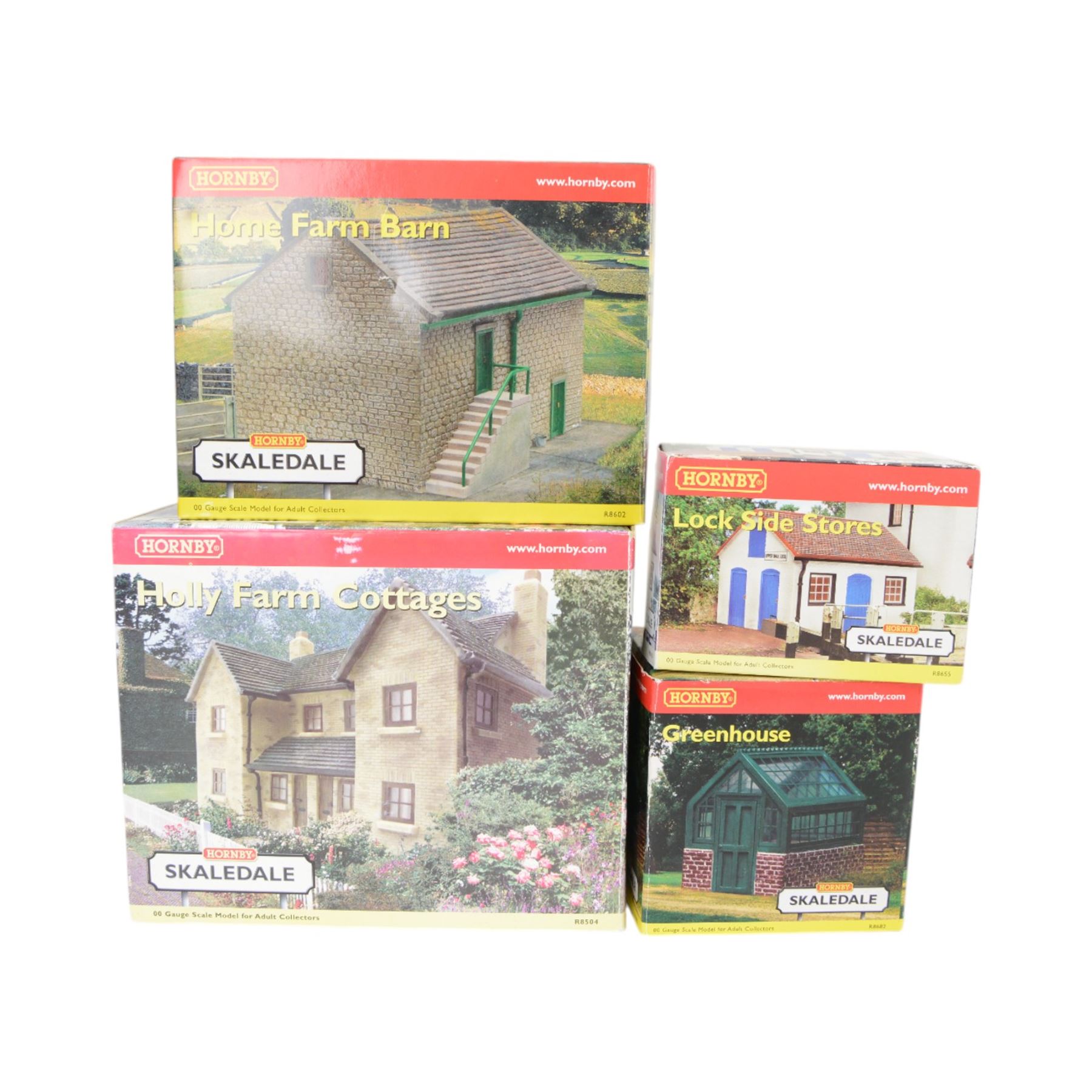 Fourteen Hornby Skaledale 00 gauge model railway trackside buildings, comprising R8504 Holly Farm Cottages, R8501 Ravenn Cottage, R8655 Lock Side Stores, R8550 Ticklepenny Cottage, R8719 Lower Skaledale Waiting Room, R8602 Holly Farm Barn, two R8633 Covered Coal Shed, R8525 Holly Farm Stables, R8629 Station Building, R8571 Road Over Bridge, R8856 Skaledale East Waiting Room, R8990 Cricket Pavillion and R8682 Greenhouse, all boxed