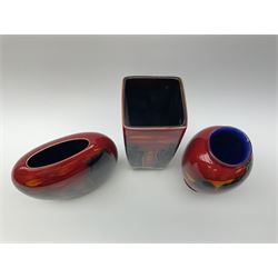 A Poole Pottery vase, of ovoid form decorated with green and yellow forms upon a red glazed ground, H20cm, together with two Anita Harris Art Pottery vase, with similar decoration. 