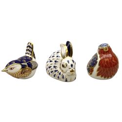 Three Royal Crown Derby paperweights, comprising two examples modelled as birds, and another modelled as a rabbit, one with gold stopper, the other two with silver stoppers. 