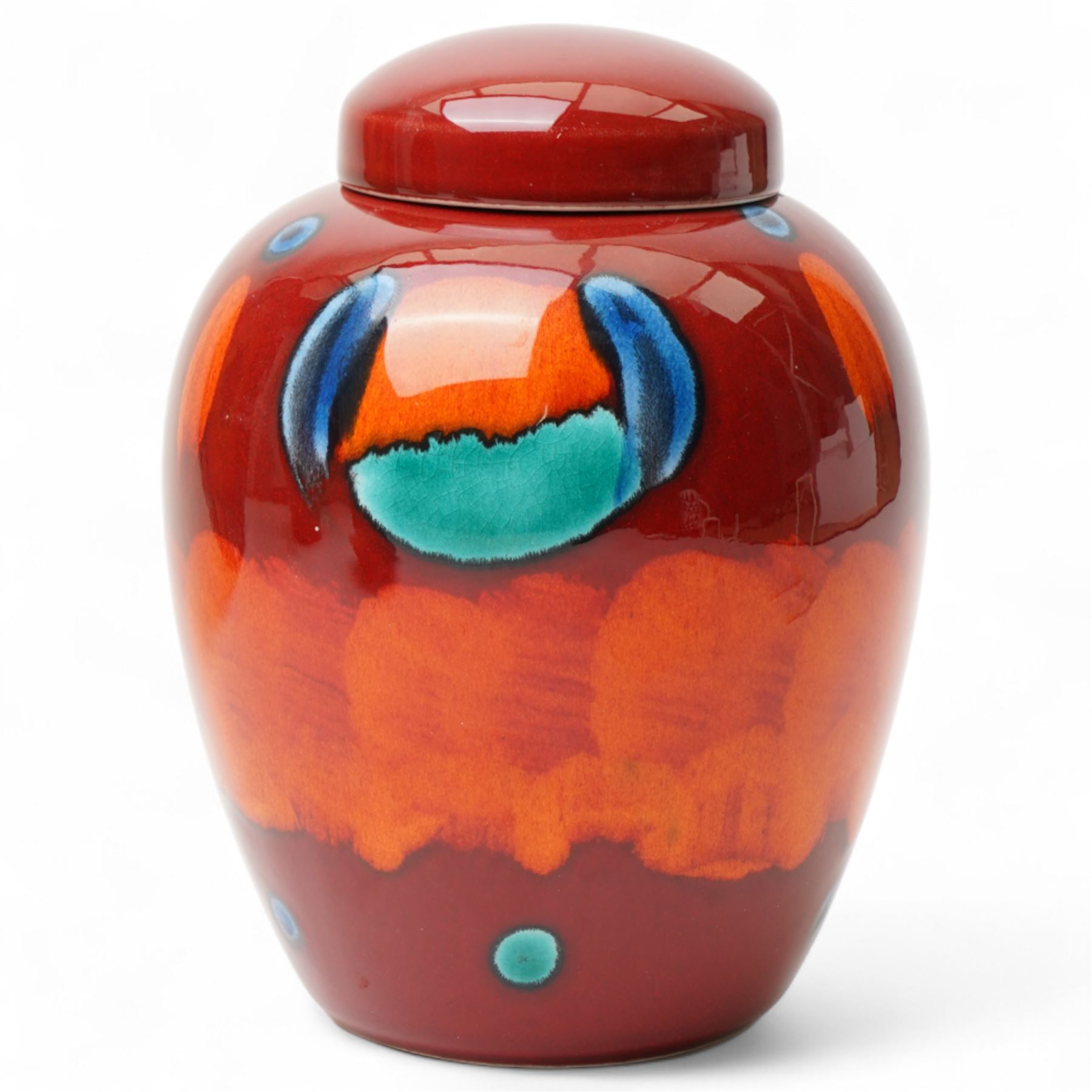 Four Poole pottery 'Volcano' pattern items comprising charger