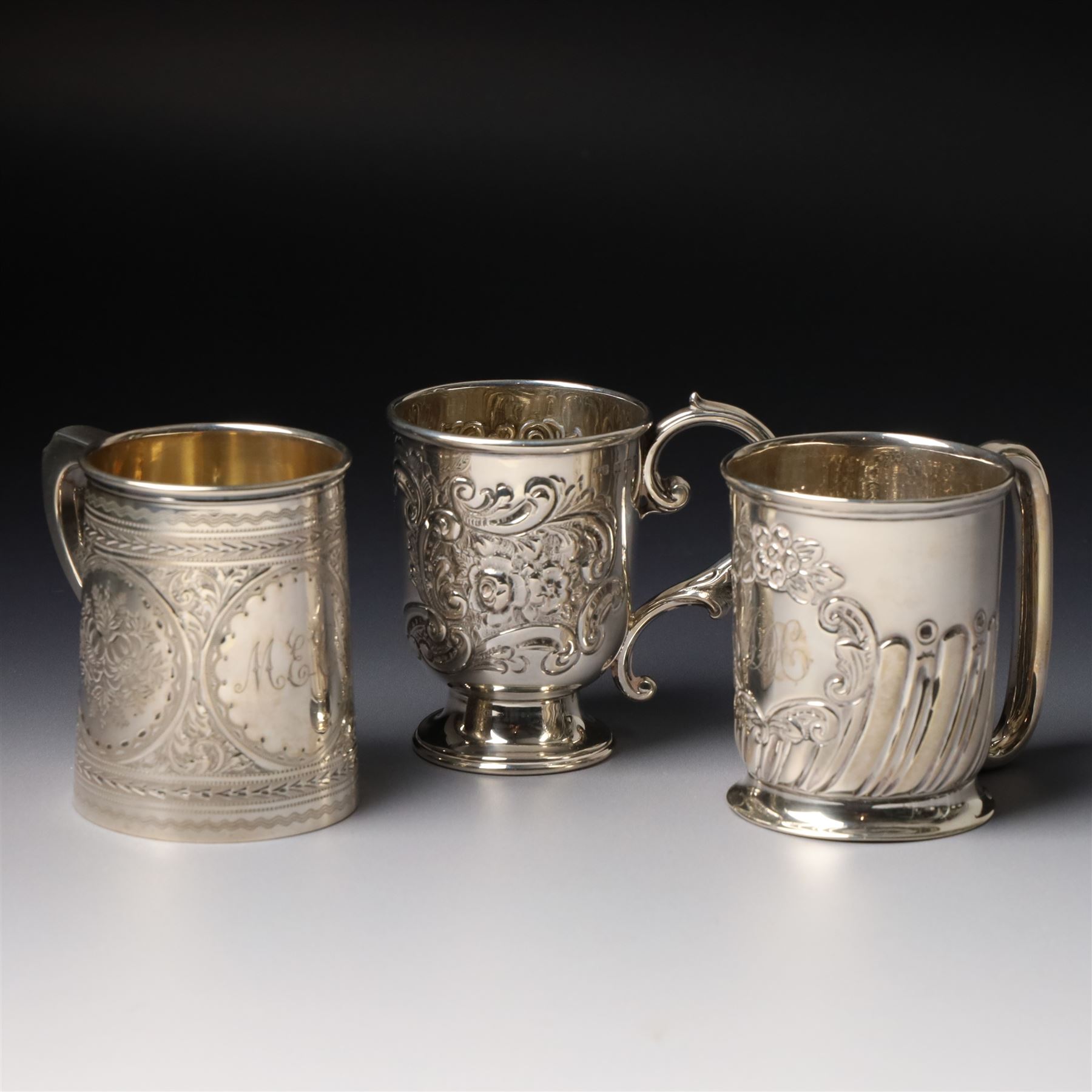 Edwardian silver christening mug with engraved decoration H8cm Birmingham 1902 and two others 1900 and 1902