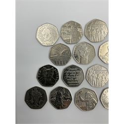 Twenty-four Queen Elizabeth II Great British commemorative fifty pence coins from circulation, including Paddington Bear, Peter Rabbit and Benjamin Bunny